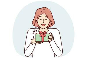 Happy woman holding gift box rejoicing in birthday or Christmas surprise received. Vector image