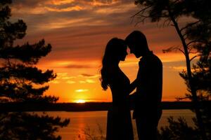 AI generated A silhouette of a couple embracing against the backdrop of a beautiful sunset photo