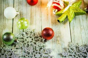 Christmas Holiday Lights and Ornaments on Wood Background photo