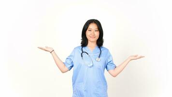 Young Asian female doctor showing copy space on two open palm isolated on white background photo