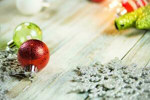 Christmas Holiday Lights and Ornaments on Wood Background photo