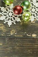 Christmas Holiday Ornaments on a Dark Wood Background. photo