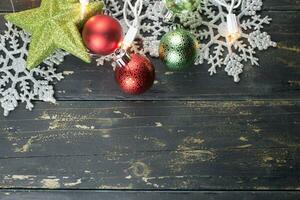 Christmas Holiday Ornaments on a Dark Wood Background. photo