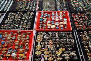 Indian beads and jewelry on the counter in store. photo