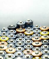 Salt and alkaline batteries, source of energy for portable technology. AAA and AA batteries photo