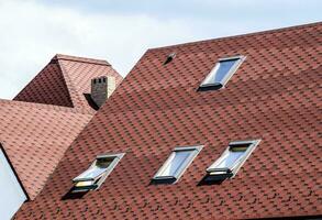 Decorative metal tile on a roof photo