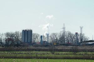 The smoke from the chimney of  plant photo