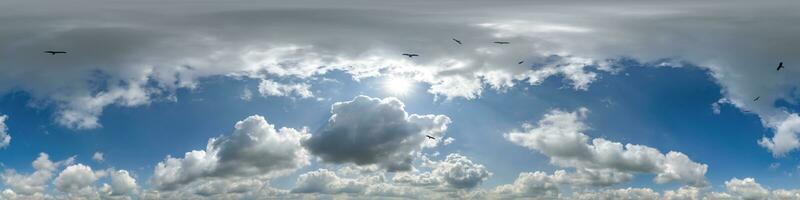 seamless cloudy blue skydome 360 hdri panorama view with flock of birds in awesome clouds with zenith for use in 3d graphics or game as sky dome or edit drone shot photo