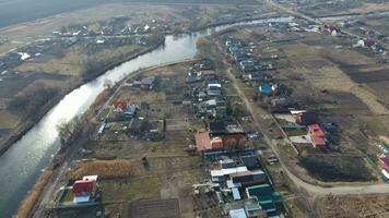 View from the top of the village. Streets without asphalt and single-storey houses. The Kuban village. photo