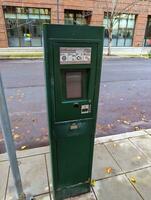 Portland, Oregon, USA - 12.28.2023 Parking meter on a city street. photo