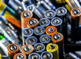 Salt and alkaline batteries, source of energy for portable technology. AAA and AA batteries photo