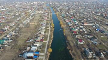 View from the top of the village. Streets without asphalt and single-storey houses. The Kuban village. photo