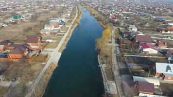 View from the top of the village. Streets without asphalt and single-storey houses. The Kuban village. photo