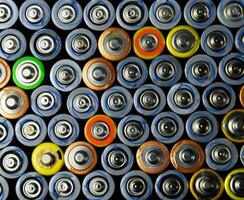 Salt and alkaline batteries, source of energy for portable technology. AAA and AA batteries photo