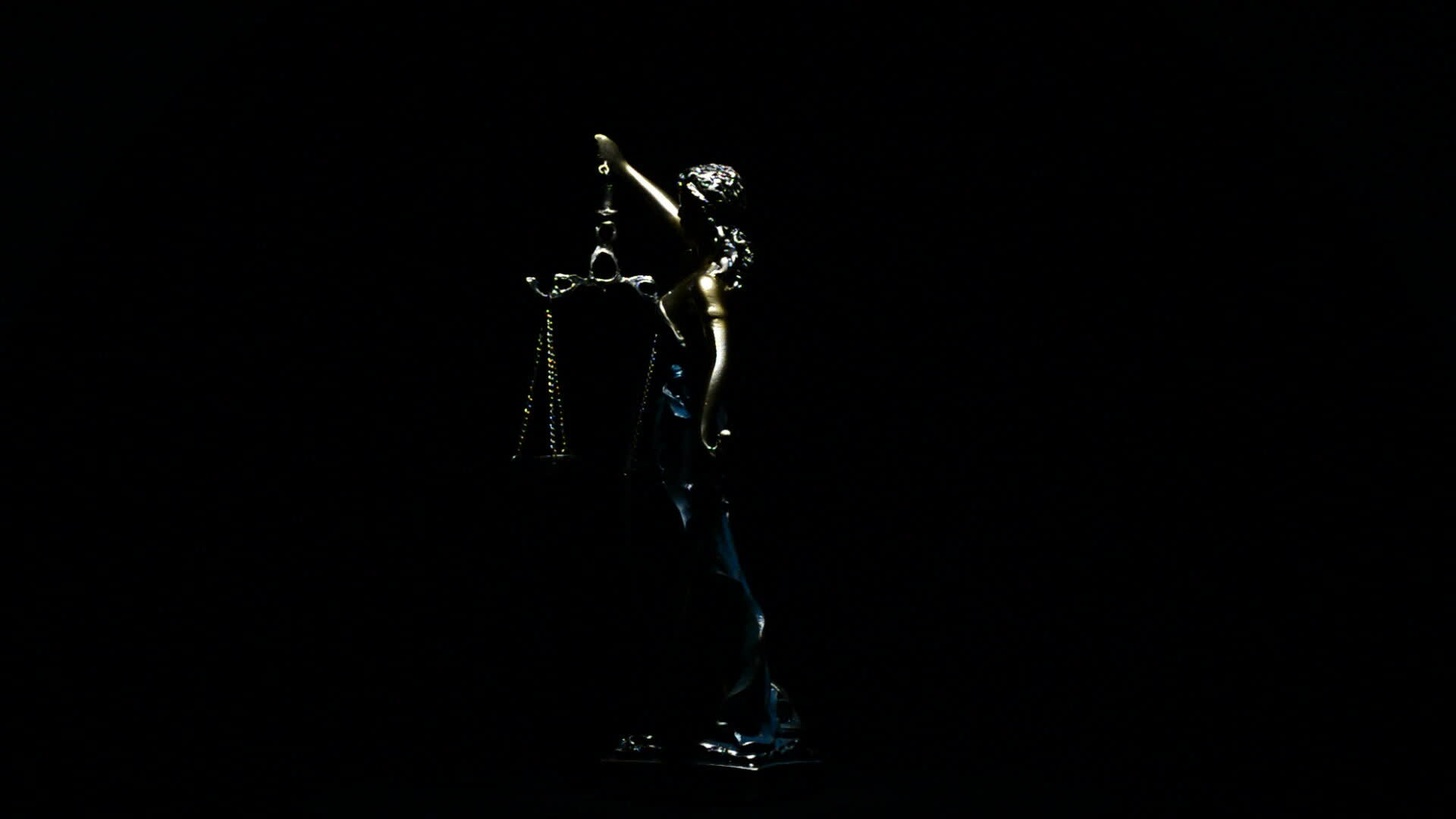 Lady justice gyrating over black background 36116875 Stock Video at