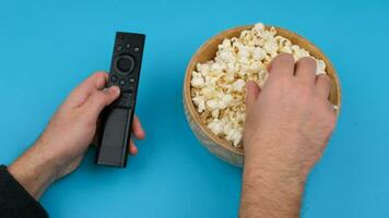 remote controller and popcorn. High quality 4k footage video
