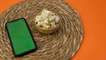 green screen phone with popcorn. High quality 4k footage video
