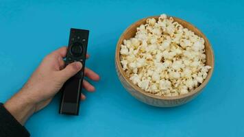 tv remote controller and popcorn. High quality 4k footage video