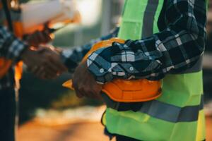 Team Construction or engineering group and worker. Teamwork and determination to succeed. Safety hard hat to prevent accident while working Transport and Container Team. Concept Restart and new Normal photo