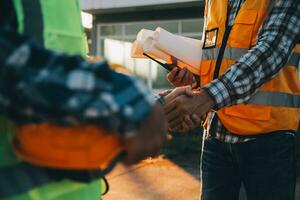 Team Construction or engineering group and worker. Teamwork and determination to succeed. Safety hard hat to prevent accident while working Transport and Container Team. Concept Restart and new Normal photo