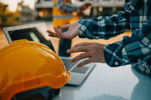 Team Construction or engineering group and worker. Teamwork and determination to succeed. Safety hard hat to prevent accident while working Transport and Container Team. Concept Restart and new Normal photo