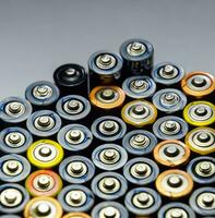 Salt and alkaline batteries, source of energy for portable technology. AAA and AA batteries photo