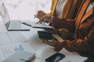 Team of business people working together in the meeting room office, teamwork background charts and graphs banner, double exposure successful teamwork,business planning concept. photo