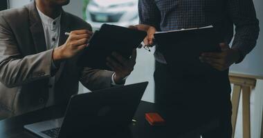 Audit concept,Administrator business man financial inspector and secretary making report calculating balance. Internal Revenue Service checking document. photo