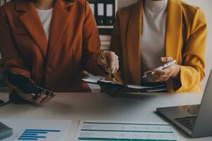 Team of business people working together in the meeting room office, teamwork background charts and graphs banner, double exposure successful teamwork,business planning concept. photo