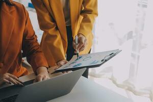 Team of business people working together in the meeting room office, teamwork background charts and graphs banner, double exposure successful teamwork,business planning concept. photo