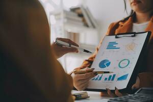 Team of business people working together in the meeting room office, teamwork background charts and graphs banner, double exposure successful teamwork,business planning concept. photo