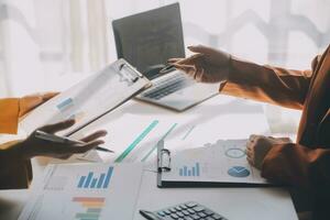 Team of business people working together in the meeting room office, teamwork background charts and graphs banner, double exposure successful teamwork,business planning concept. photo