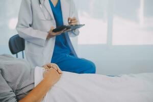 Female doctor administers specialized medical treatment to a patient in a hospital room. The procedure includes fluid therapy and injections to support the patient's health diagnosis and recovery. photo