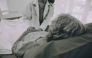 Doctor taking care, help and encourage Asian elder senior woman patient in clinic hospital. photo