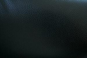 Black background. Leather car seat covers and sofas. photo