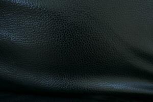 Black background. Leather car seat covers and sofas. photo