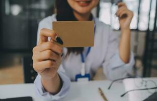 Women holding credit card and using smartphones at home.Online shopping, internet banking, store online, payment, spending money, e-commerce payment at the store, credit card, concept photo