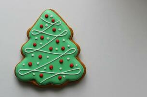 Shortbread Cookie In Pine Tree Shape With Colored Icing On Isolated On White Concept Design For Greeting Card photo