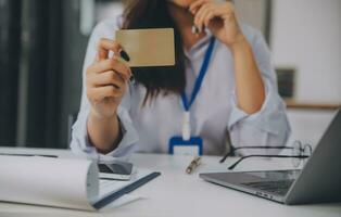 Women holding credit card and using smartphones at home.Online shopping, internet banking, store online, payment, spending money, e-commerce payment at the store, credit card, concept photo