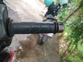 A photo of a black motorcycle gas or brake pull