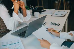 Business team collaboration discussing working analyzing with financial data and marketing growth report graph in team, presentation and brainstorming to strategy planning making profit of company. photo