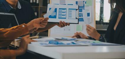 Close up ux developer and ui designer use augmented reality brainstorming about mobile app interface wireframe design on desk at modern office.Creative digital development agency photo