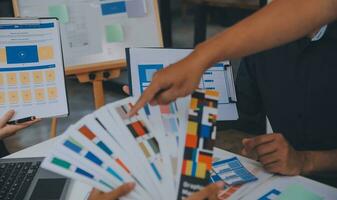 Close up ux developer and ui designer use augmented reality brainstorming about mobile app interface wireframe design on desk at modern office.Creative digital development agency photo