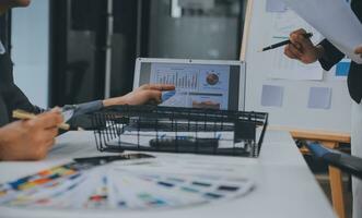Close up ux developer and ui designer use augmented reality brainstorming about mobile app interface wireframe design on desk at modern office.Creative digital development agency photo