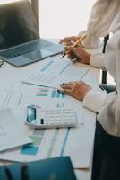 Business team collaboration discussing working analyzing with financial data and marketing growth report graph in team, presentation and brainstorming to strategy planning making profit of company. photo