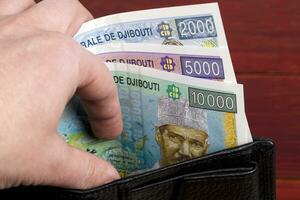 Djiboutian franc in the black wallet photo