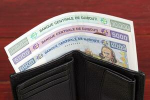 Djiboutian franc in the black wallet photo