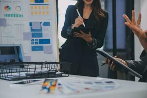 Close up ux developer and ui designer use augmented reality brainstorming about mobile app interface wireframe design on desk at modern office.Creative digital development agency photo