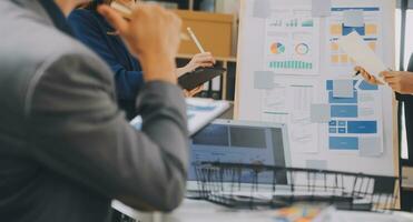 Close up ux developer and ui designer use augmented reality brainstorming about mobile app interface wireframe design on desk at modern office.Creative digital development agency photo