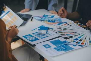 Close up ux developer and ui designer use augmented reality brainstorming about mobile app interface wireframe design on desk at modern office.Creative digital development agency photo